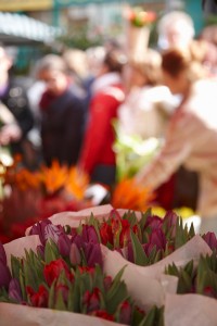 Columbia Road flower market is held every Sunday in Hackney, East London. Fresh cut flowers. Stalls and flower traders, and customers.